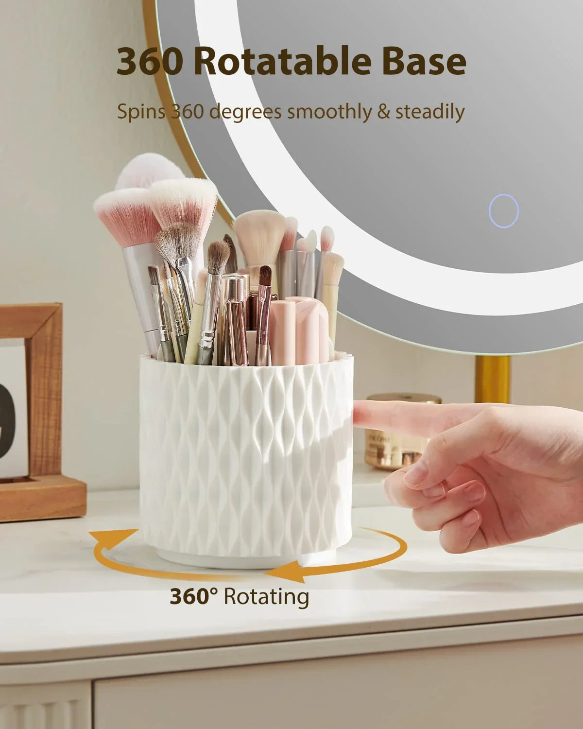 White 360-degree rotating makeup brush holder on vanity with assorted brushes